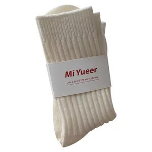 Milk white wool slouch socks for women, thick cozy warm mid-tube knit hosiery winter wear.
