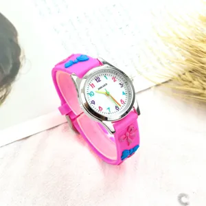 Jolie montre à quartz pour enfants en silicone rose avec chiffres colorés et nœud.