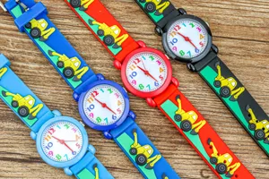 Children cartoon excavator quartz watch detail showing colorful dial numbers and cute silicone strap.