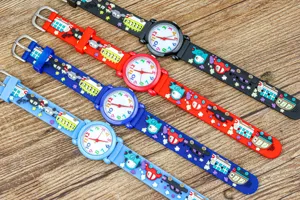 Details of kids quartz watch with colorful cartoon car strap and clear dial numbers.