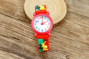 Kids red quartz watch with cartoon excavator strap and colorful numbers dial for boys.