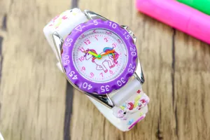 Cute kids unicorn watch with white silicone strap, purple bezel and colorful dial for girls.