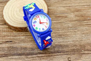 Kids cartoon quartz watch with blue strap, colorful numbers and airplane rocket decorations.