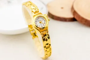 Elegante reloj de pulsera de cuarzo para mujer con acabado dorado, esfera pequeña y bonita correa.