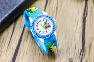Kids cartoon excavator watch detail, blue strap, clear numbers for learning time.