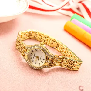 Montre quartz femme or avec strass élégant bracelet chaîne en métal mode tendance