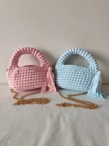 Handmade woven macaron crossbody chain bag detail showing delicate crochet texture and chic tassels.