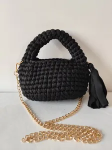 Handmade black crochet crossbody bag with thick handle, gold chain strap and stylish tassel.