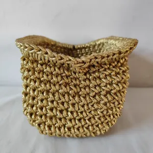 Detailed view of the metallic gold woven rope texture, showing fine craftsmanship and material.