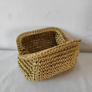 Detailed view of the gold rope woven clutch bag showcasing its unique texture and exquisite craft.