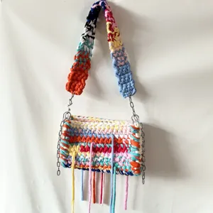 Colorful dopamine fabric crochet shoulder bag with vibrant colorblock and stylish tassels.