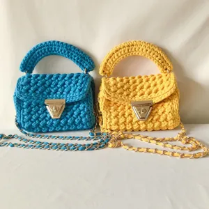 Handmade crochet shoulder bag with metal chain strap and twist lock, blue and yellow styles.