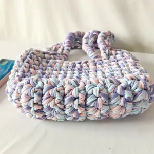 Handmade crochet fabric handbag in colorful pastel hues, lazy style aesthetic daily shoulder bag.