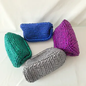 Handmade metallic crochet clutch bag detail showing multi-color woven shoulder purses options.