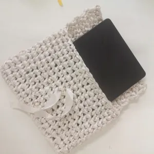 Handmade ribbon crochet tablet sleeve bag, chic woven storage pouch for electronic devices.