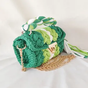 Handmade woven crochet handbag for women, chic green and white color block design with chain.