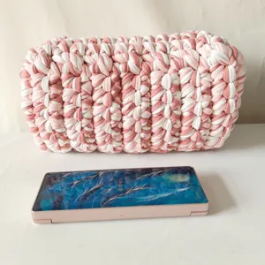 Handmade crochet fabric clutch bag stylish pink white woven cosmetic pouch for daily use.