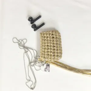 Handmade gold woven mini earphone bag with silver chain heart pendant and stylish tassel detail