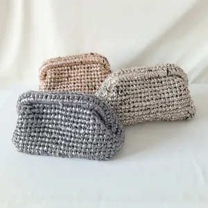 Handmade metallic crochet clutch bag, stylish woven evening purse with kiss-lock frame.