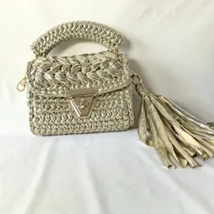 Handmade metallic fabric crochet women shoulder bag with chic chunky handle and tassel.