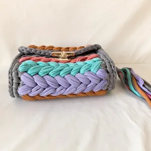 Handmade crochet crossbody bag with colorful fabric stripes, trendy chic style shoulder bag.