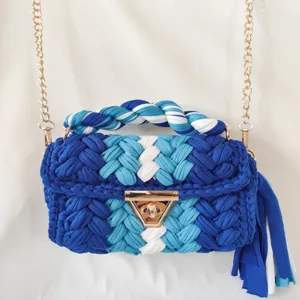 Handmade crochet women's shoulder bag with blue colorblock design and gold chain strap.