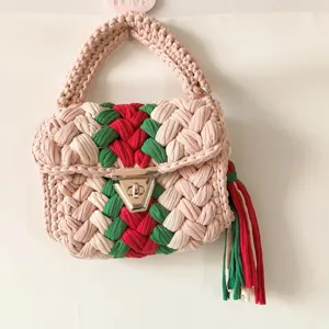 Handcrafted crochet woven crossbody bag with stylish contrast color stripes and metal lock.