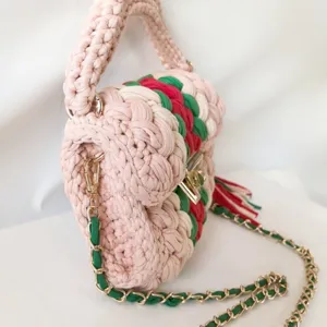 Handmade crochet crossbody bag with stylish color block design and chic chain strap for women.
