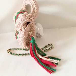 Handcrafted crochet t-shirt yarn women shoulder bag with stylish color-blocking chain.