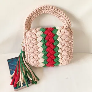 Handmade crochet handbag with stylish red and green web stripe design for women daily use.