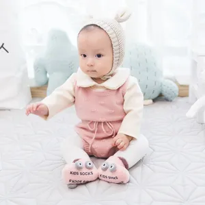 Thickened baby floor socks with cute cartoon eyes and non-slip sole, warm infant footwear for winter.