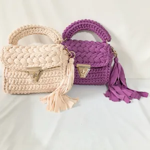 Handmade crochet woven handbag for women, stylish cloth strip shoulder bag with tassel.