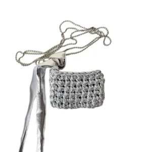 Handmade silver crochet earphone bag necklace with metallic heart pendant and ball chain strap.