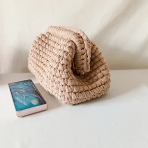 Handmade crochet fabric clutch bag, casual beige knitted purse, stylish women's daily accessory.