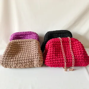 Handmade crochet fabric clutch bag with chain strap, stylish women crossbody handbag details.