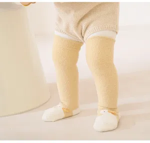 Infant thick over-the-knee socks, cute duck design, soft winter warm baby long hosiery detail.