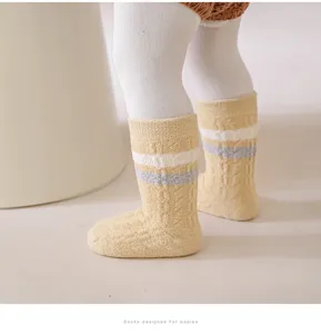 Detailed shot of thick warm newborn baby socks with cozy fleece lining and cute stripes.
