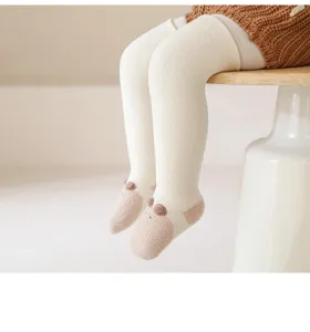 Baby thick warm over-the-knee socks detail shot, cute animal ears design, soft knit fabric.