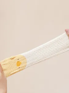 Soft warm baby winter socks with cute cartoon duck design, thick fleece comfort for infants.
