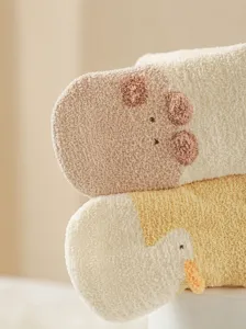 Thickened baby knee-high socks with cute 3D cartoon animal designs for warm winter wear.