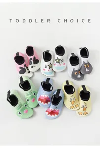 Toddler water shoes detail showing non-slip sole and cute cartoon animal designs for beach.