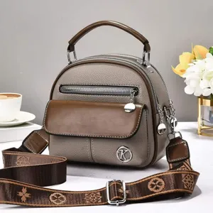 Vintage leather shoulder bag for women, stylish crossbody handbag with top handle.