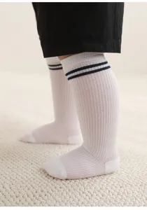 Kids thin mesh long socks detail view, showing breathable fabric and classic double stripe top design