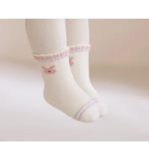 Infant cotton socks close up featuring cute bunny design and soft ruffled elastic cuffs.