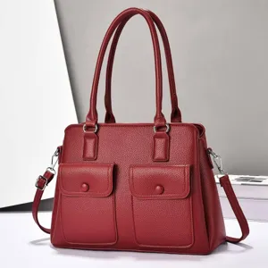 Red leather tote bag with double handles, spacious triple compartments and front pockets.