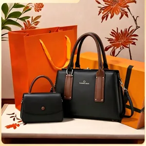 Detailed view of women black handbag set with brown handles and elegant design for daily use.