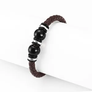 Men braided leather bracelet with black beads and silver rings, vintage detailed accessory.