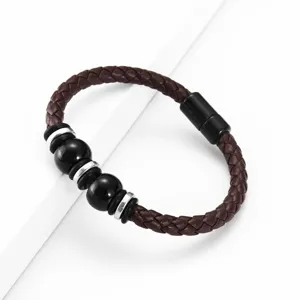 Men braided leather bracelet with black beads and magnetic clasp vintage style detail shot