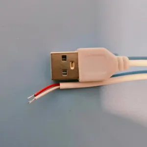 Universal USB cable connector with stripped wire ends, perfect for DIY night light repairs.