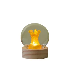 Creative glowing night light with wooden base and glass ball for bedroom desktop decor gift.
